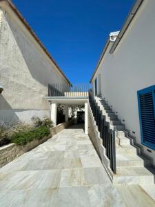a stairway leading up to a building with a stair case at BEACHFRONT VILLA Murter in Murter