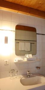 Koupelna v ubytování Hotel Alpina