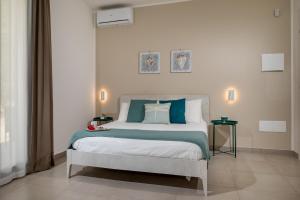 Posteľ alebo postele v izbe v ubytovaní Villa Maria con piscina e vista mare