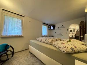 a bedroom with a bed and a television in it at Haus Gisela in Thale