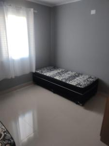 Кровать или кровати в номере Catarina Home Club Mairinque
