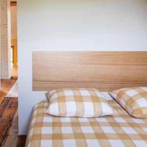 Postel nebo postele na pokoji v ubytování GRAACE Suite