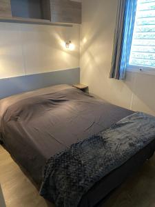 Postel nebo postele na pokoji v ubytování Mobilhome 516