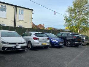 a row of parked cars in a parking lot at The Northdale Hotel Ltd in Skegness