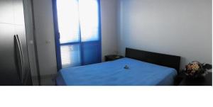 Un pat sau paturi într-o cameră la Residence Blue Sky