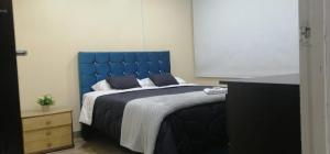 Tempat tidur dalam kamar di Roma Lodges House - Turin- Campin Movistar Embajada cubo colsubsidio