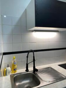 Kuchyň nebo kuchyňský kout v ubytování Petit duplex cocooning