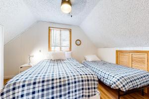 Кровать или кровати в номере Rockhouse Mountain Retreat