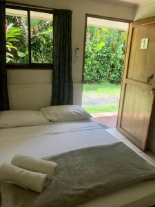 Postel nebo postele na pokoji v ubytování Le Petit Hotel