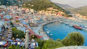 an aerial view of a town with boats in the water at Pargas paradise in Parga