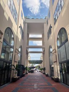 a large building with a walkway in the middle at Elements Hotel & Shops Curaçao in Willemstad