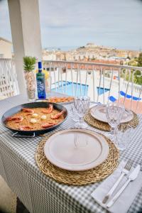 a table with plates of food on top of a table at MARINA VILLAGE Peñíscola in Peñíscola