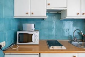 Kuchnia lub aneks kuchenny w obiekcie Oriente Suites