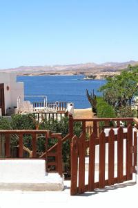 a wooden fence with a view of the water at Abouseif Guest House in Sharm El Sheikh