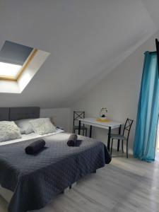 Pokoje i apartamenty MatDar客房内的一张或多张床位