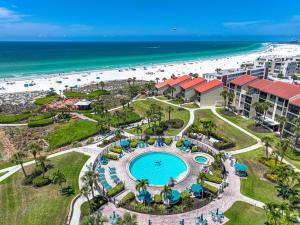 an aerial view of a resort with a swimming pool and the beach at Stay Siesta Dunes, #300; by Beachside Management in Siesta Key
