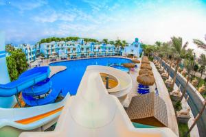 a pool at a resort with a water slide at Mirage Apartments & Aqua Park in Hurghada