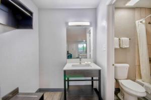 a bathroom with a sink and a toilet at Motel 6 Texarkana, TX in Texarkana +28 photos