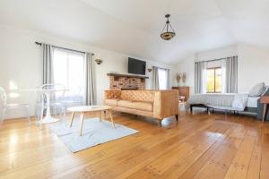 a living room with a couch and a table at 30 PCT OFF! Malibu Romantic Suite, Ocean View, Beach in Malibu