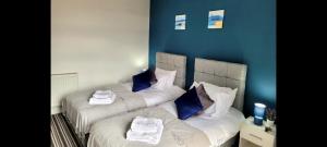 A bed or beds in a room at Bury Stays