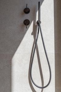 a shadow of a shower head in a bathroom at Maravilla Luxury Living in Kos