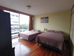Ένα ή περισσότερα κρεβάτια σε δωμάτιο στο Apartamento 908 Cortijo Reforma zona 9