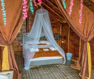 Postel nebo postele na pokoji v ubytování Glamping Mirador Santa Fe-Sopetran