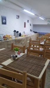 a room with a table and chairs in a kitchen at Pousada Solar Teresa in Petrópolis