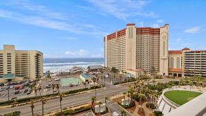 a view of a city with buildings and the ocean at Some Beach Some Where at Laketown Wharf #825 by Nautical Properties in Panama City Beach