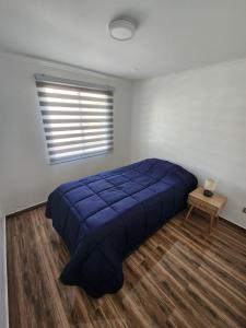 A bed or beds in a room at Casa blanca bella vista