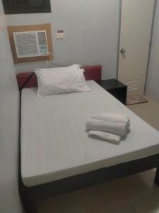 Postel nebo postele na pokoji v ubytování V.F. Riton Apartelle
