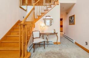 a home office with a table and stairs at Villa Verde B&B, Greenwood Lake, NY in Monroe