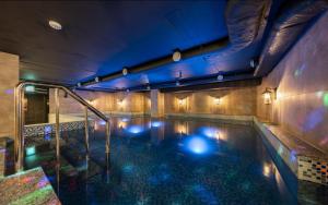 a indoor swimming pool with lights in a building at Shinchon Wol Hotel in Seoul
