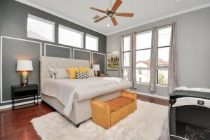 a bedroom with a bed and a ceiling fan at 3BR 3Ba Upscale Luxury Home in The Heights in Houston