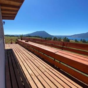 a train station with a bench with a view at Lomas de Riñihue para 2p in Valdivia