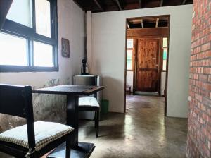 a room with a table and chairs and a door at Historical townhouse in city center in Tainan +8 photos