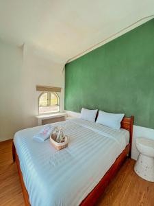 Ein Bett oder Betten in einem Zimmer der Unterkunft Renjana Beach House