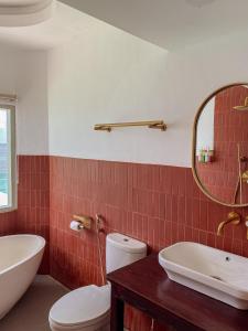 Ein Badezimmer in der Unterkunft Renjana Beach House