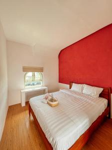 Ein Bett oder Betten in einem Zimmer der Unterkunft Renjana Beach House