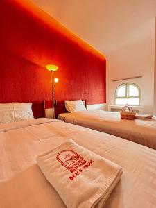 Ein Bett oder Betten in einem Zimmer der Unterkunft Renjana Beach House