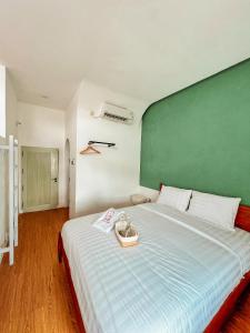 Ein Bett oder Betten in einem Zimmer der Unterkunft Renjana Beach House