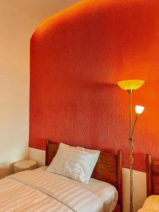 Ein Bett oder Betten in einem Zimmer der Unterkunft Renjana Beach House