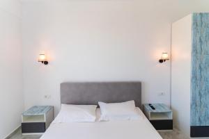 En eller flere senge i et værelse på Luxury residence Mamaia