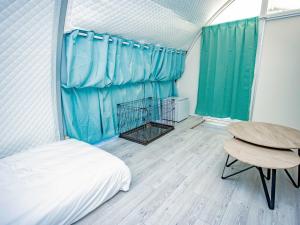 Letto o letti in una camera di GLAMTECH RESORTS HEAVEN