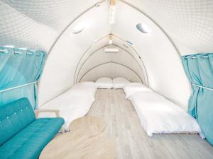 Letto o letti in una camera di GLAMTECH RESORTS HEAVEN