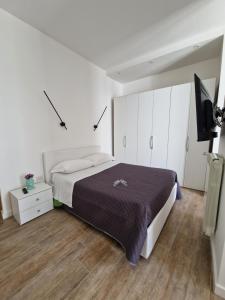 A bed or beds in a room at Amiura B&B