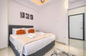 Postel nebo postele na pokoji v ubytování Yekta Blue 3 Residence by NewInn