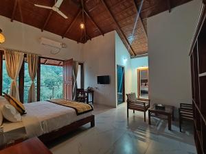 Postel nebo postele na pokoji v ubytování Hill Crest Resort - Coorg