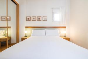 Łóżko lub łóżka w pokoju w obiekcie Oriente Suites