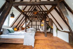 a room with four beds in a attic at Haus zum Ring in Adenau